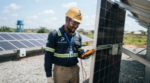 Solar System Maintenance: How to Protect Performance and Battery Life engineer standing by solar panel 202608221144