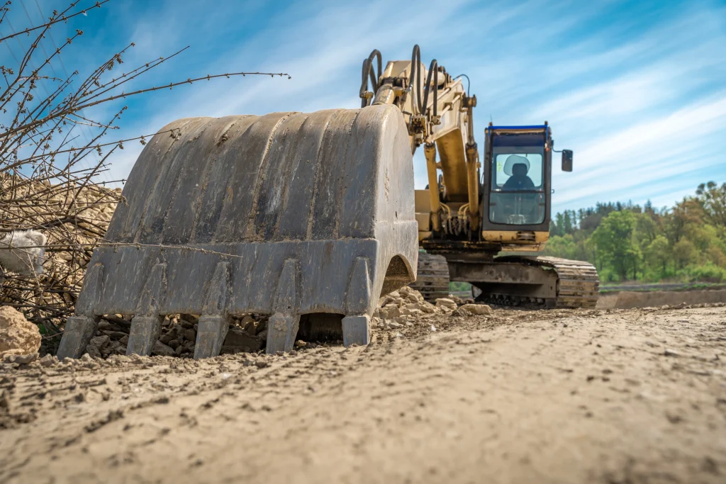 Complete Quarry Solutions: From Setup and Operations to Sustainable Growth vecteezy excavator parked on construction site 1223657